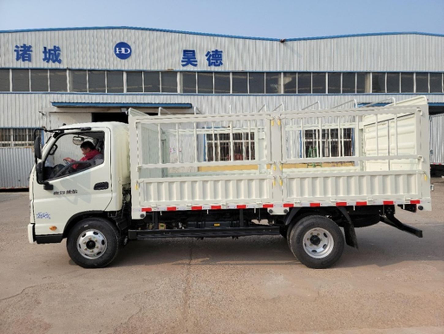 White light truck with a low stake cargo body