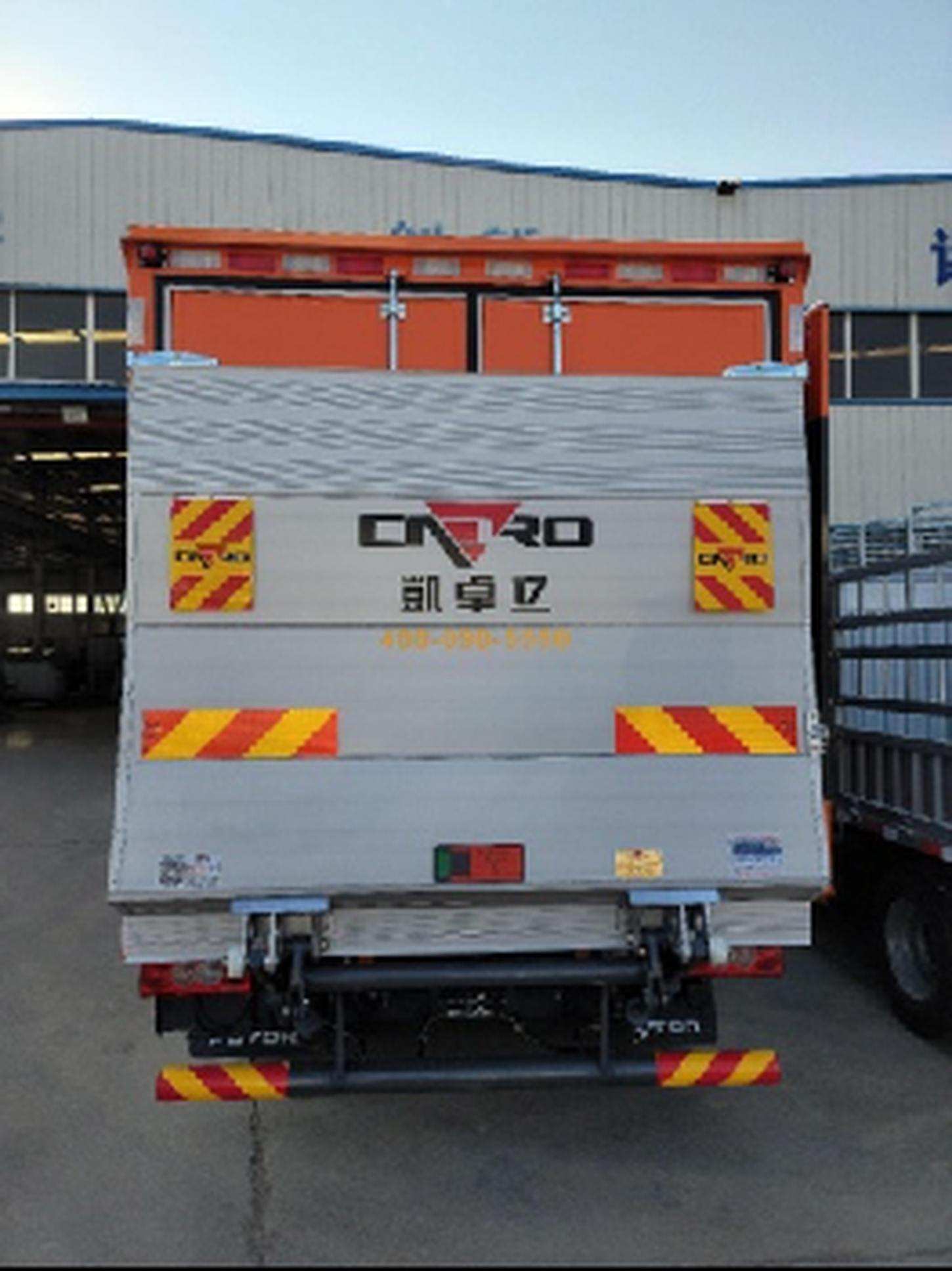 Rear view of a cargo truck with a hydraulic tail lift